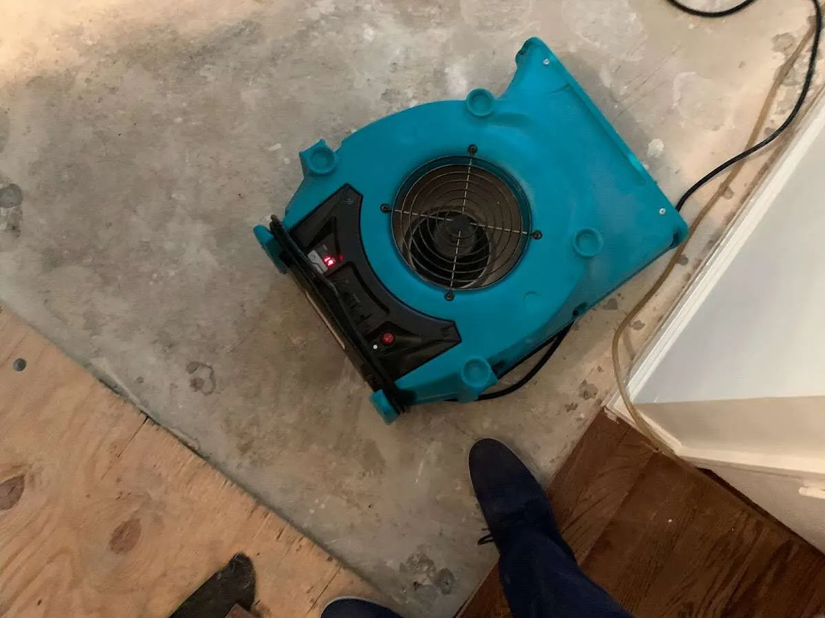 Air mover drying subfloor during Leak Detection & Repair in West New York