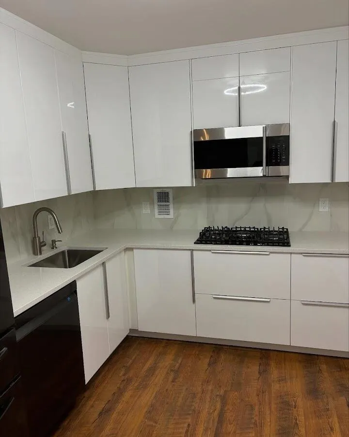 Restored kitchen with white cabinets after water damage in West New York